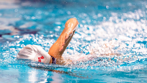 a picture showing a man swimming in the pool