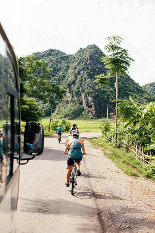 Group of people riding bicycles on the road