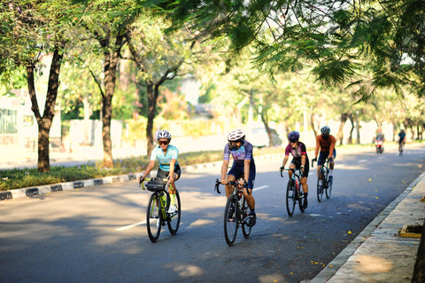 Group of people riding bicycles on the road