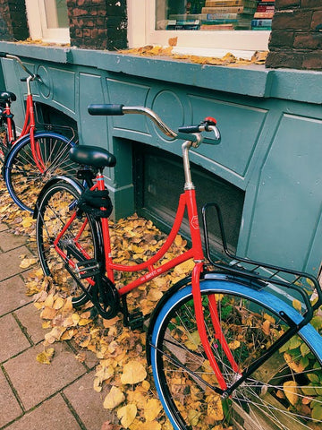 red bike in the urban area where bike locks are needed