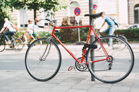 red bike with bike lock in the city